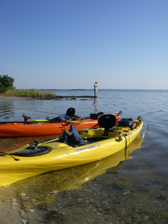 Kayaks and fisherman at Cedar Key, Florida