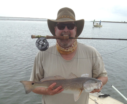 Phil Holding a Redfish