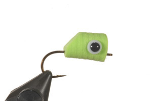 Body with eyes glued into the holes.